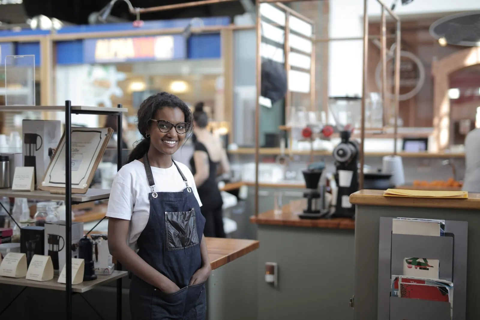 A café owner behind her counter